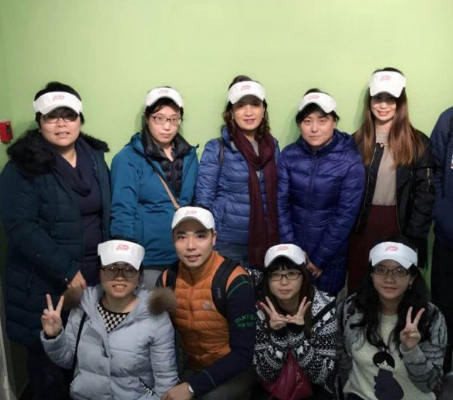 group of ADP associates wearing heavy coats and white sun visors