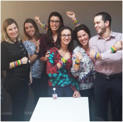 ADP HR team wearing colorful bracelets