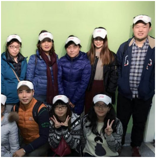 group of ADP associates wearing heavy coats and white sun visors