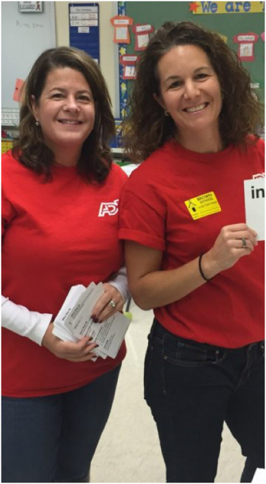 two ADP associates wearing red T-shirts