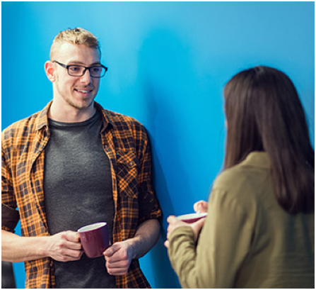 two ADP associates conversing with one another