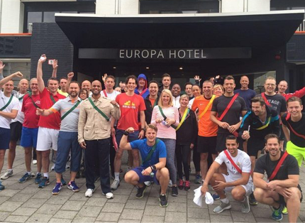 large group of ADP associates standing in front of Europa Hotel entrance