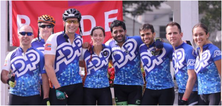 Group of ADP associates wearing ADP cycling gear