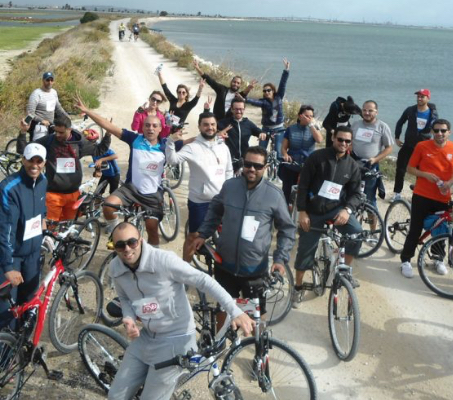 group of ADP associates on bicycles