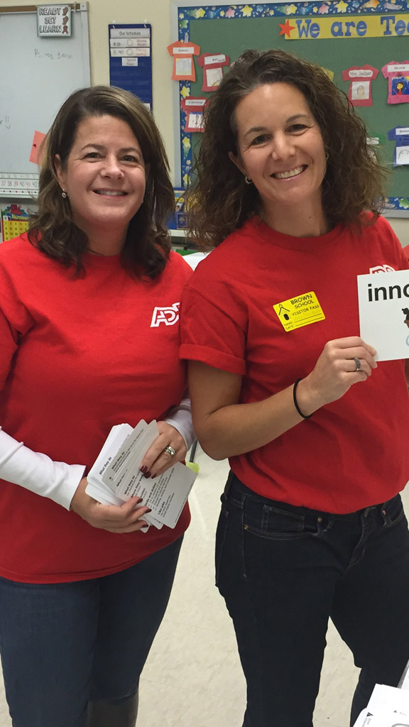 two female ADP associates in red T-shirts